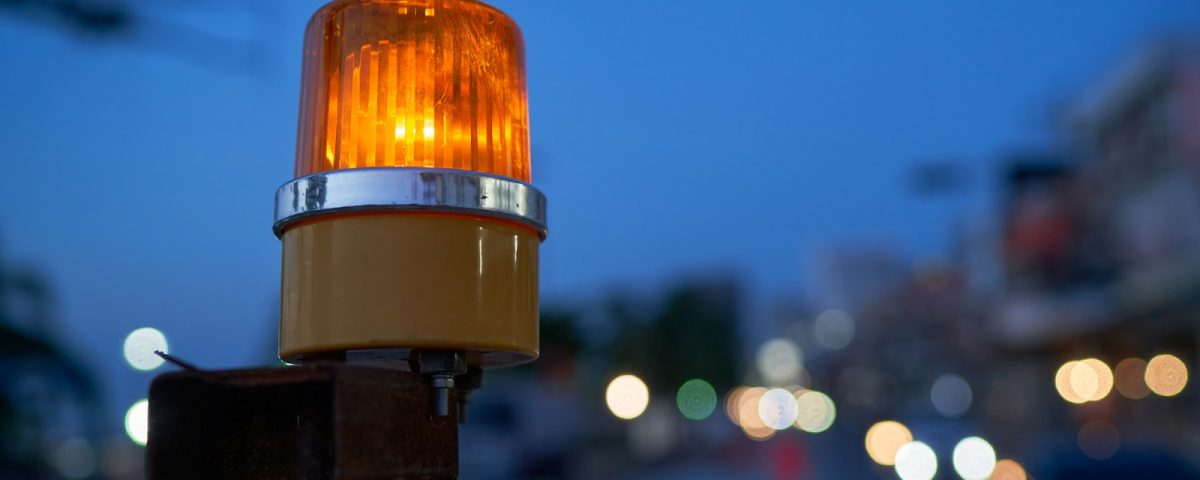 a traffic light sitting on the side of a road