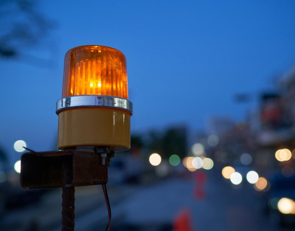 a traffic light sitting on the side of a road